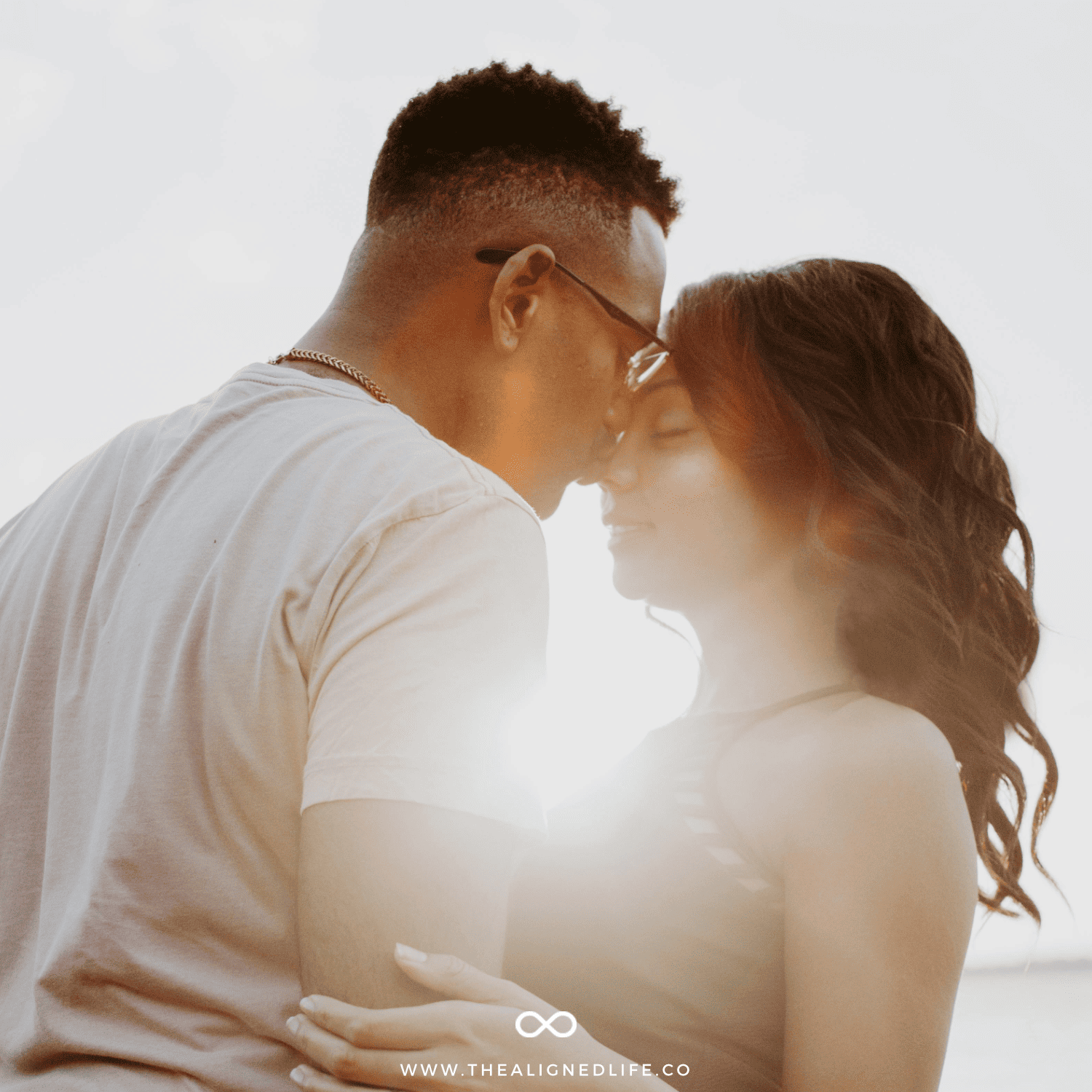 woman and man kissing in the sunshine | 111 Affirmations To Manifest Your Ex Back | The Aligned Life Manifestation Blog