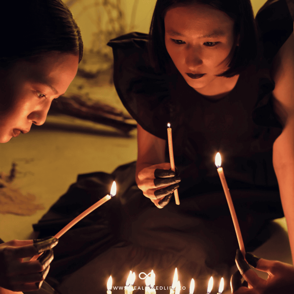 3 women with dark hair lighting candles | How To Manifest Whatever TF You Want | The Aligned Life Manifestation Blog
