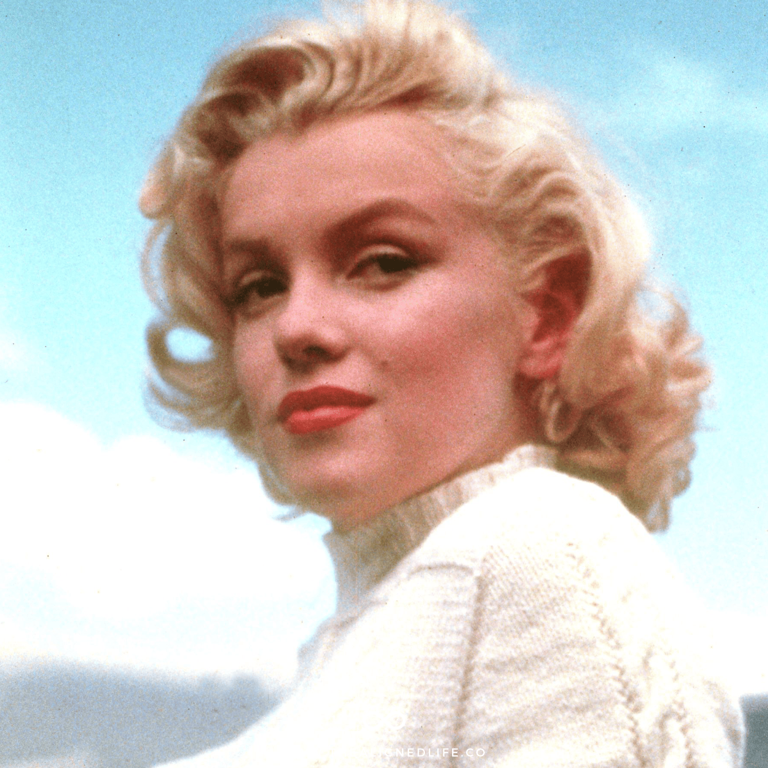 Marilyn Monroe in a white sweater | The Marilyn Monroe Manifestation Technique | The Aligned Life Manifestation Blog
