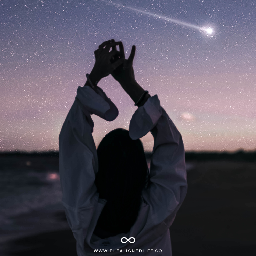 woman dancing in front of starry sky | How To Survive Mercury Retrograde | The Aligned Life Manifestation + Spirituality Blog