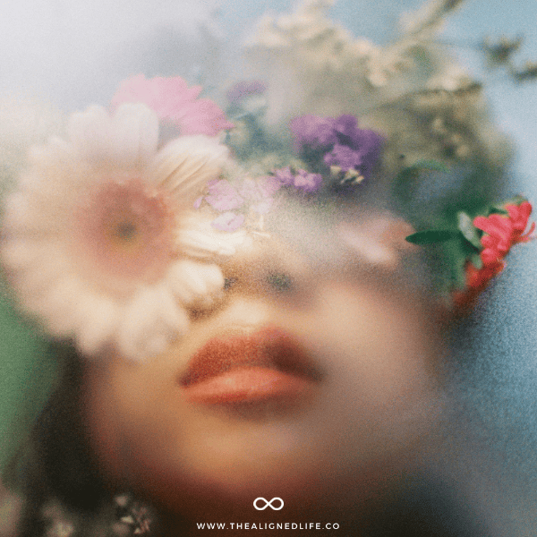 blurry photo of a woman with flowers on her head | Manifest With AI - Free GPT Tool | The Aligned Life Manifestation Blog