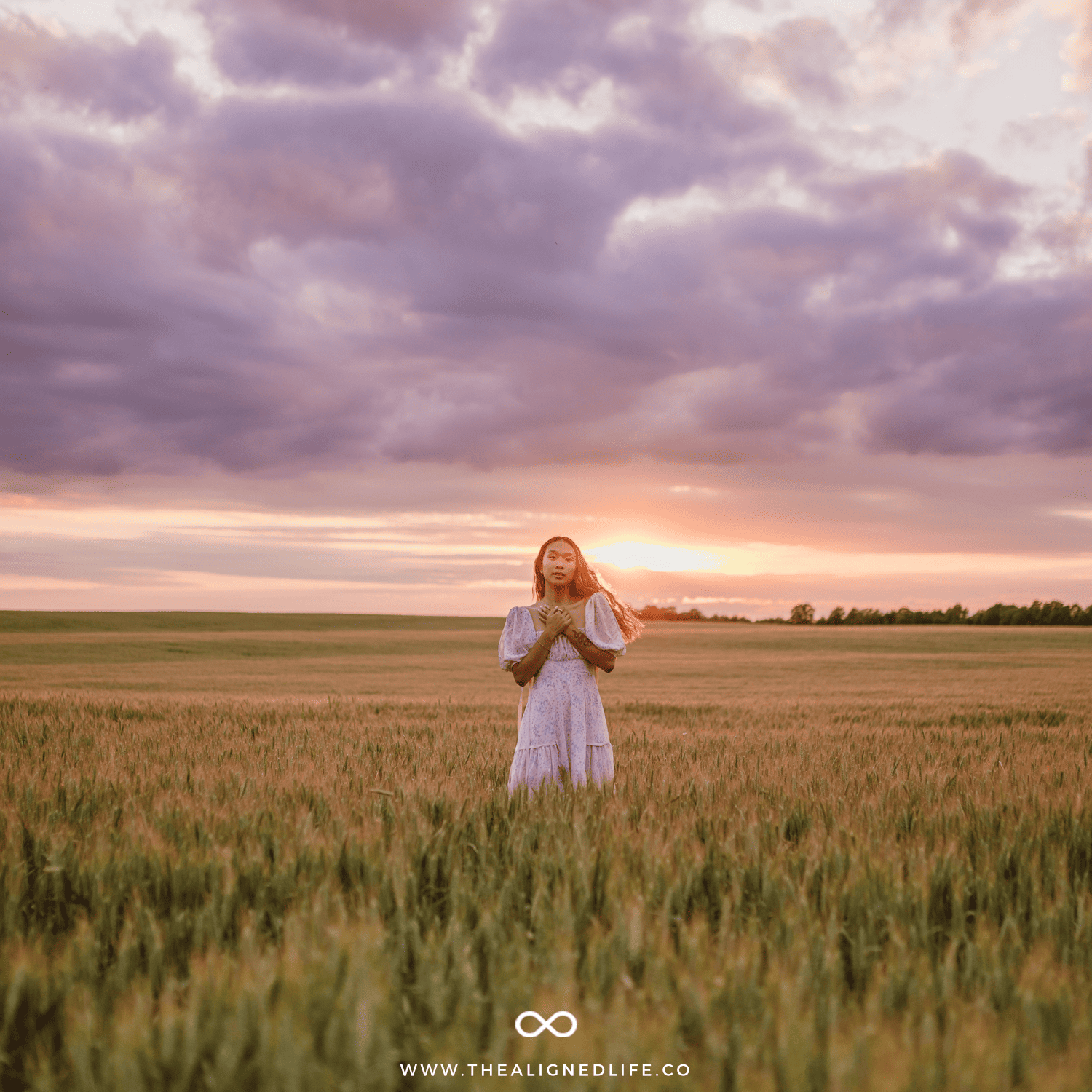 woman in a field at sunset | How To Unfuck Your Life | The Aligned Life Manifestation + Spirituality Blog