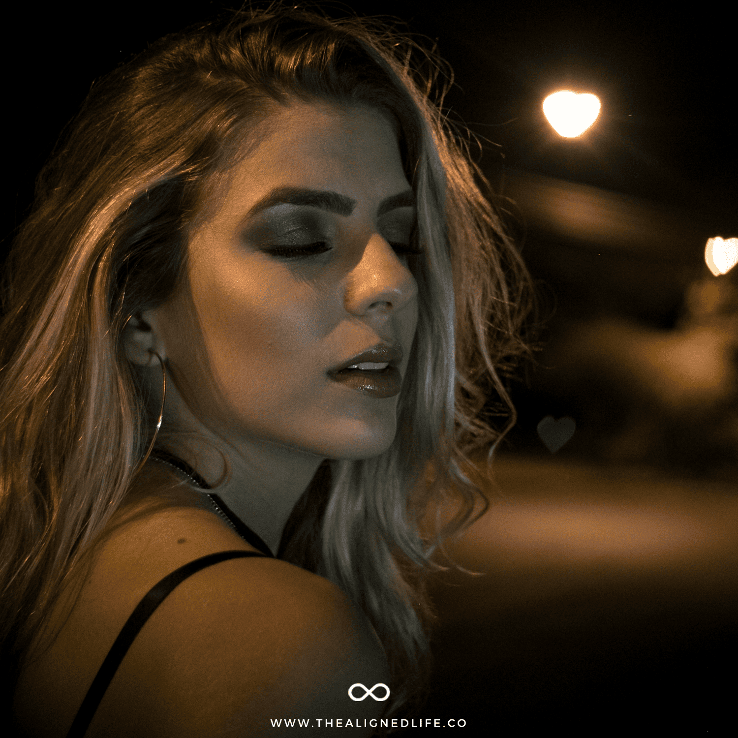 blonde woman with purple eye shadow on a dark street | DIY EMDR: Home Treatment For Emotional Healing | The Aligned Life