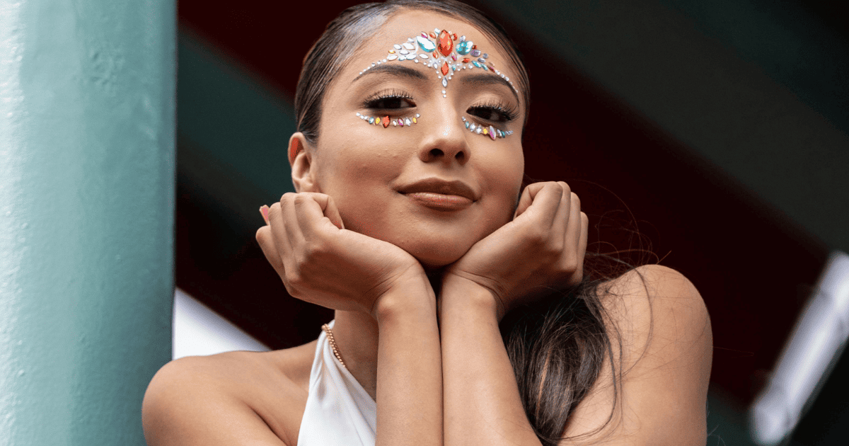 woman with jewels on her face | 15 Ways To Manifest Everything On Your Vision Board | The Aligned Life Manifestation Blog