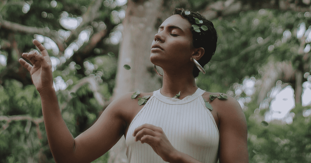 woman with her eyes closed in a forest | 3 Cord Cutting Rituals For Letting Go | The Aligned Life Manifestation Blog