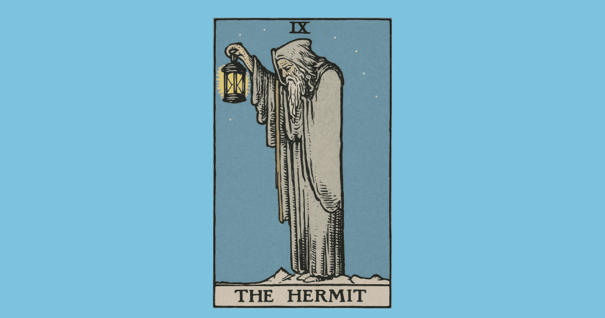 a man with a grey beard holds a lantern and a walking stick | The Hermit tarot card from the RIder Waite deck