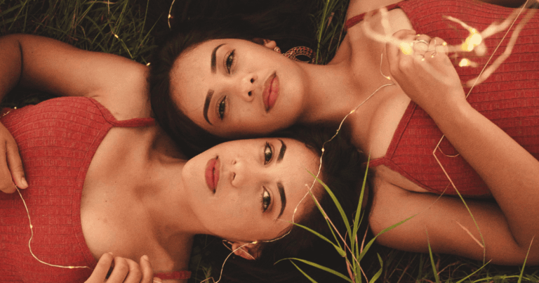 twins with dark hair lying in grass | Gemini Season: Journal Prompts, Ritual Ideas, Horoscopes & More! | The Aligned Life Manifestation & Spirituality Blog