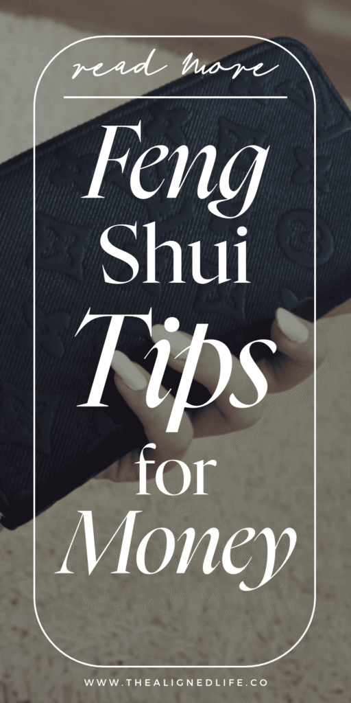 woman's hand with white manicure holding a black Louis Vuitton wallet | 10 Feng Shui Tricks for Money & Abundance