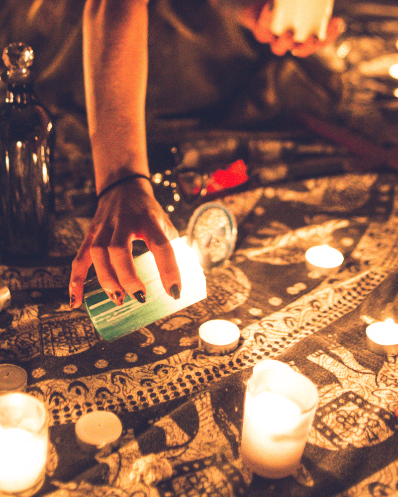 hand with candles on a blanket